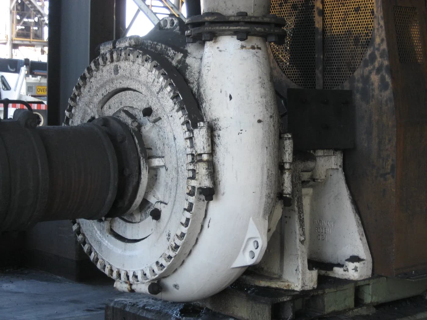 Heavy duty slurry pump with a thick walled casing, large clearance impeller and heavy bearing frame